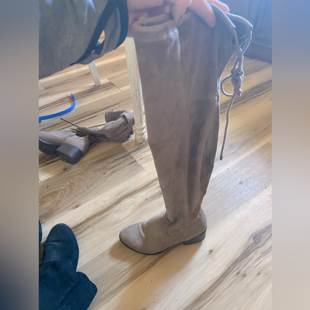 Tan long boots size 7 with a tie on the back. Super cute!